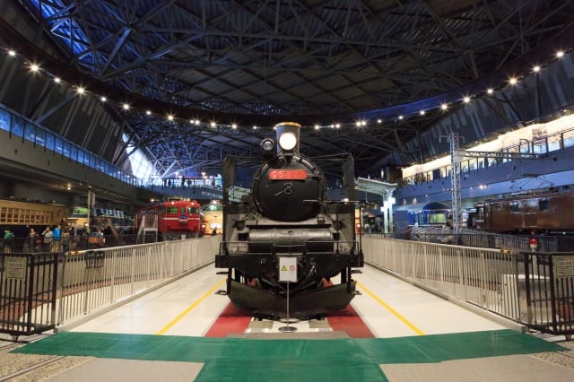 The interior of the Saitama Railway Museum's warehouse of steam locomotives and trains.