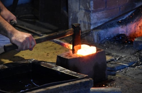 The steel is cut, folded and hammered repeatedly