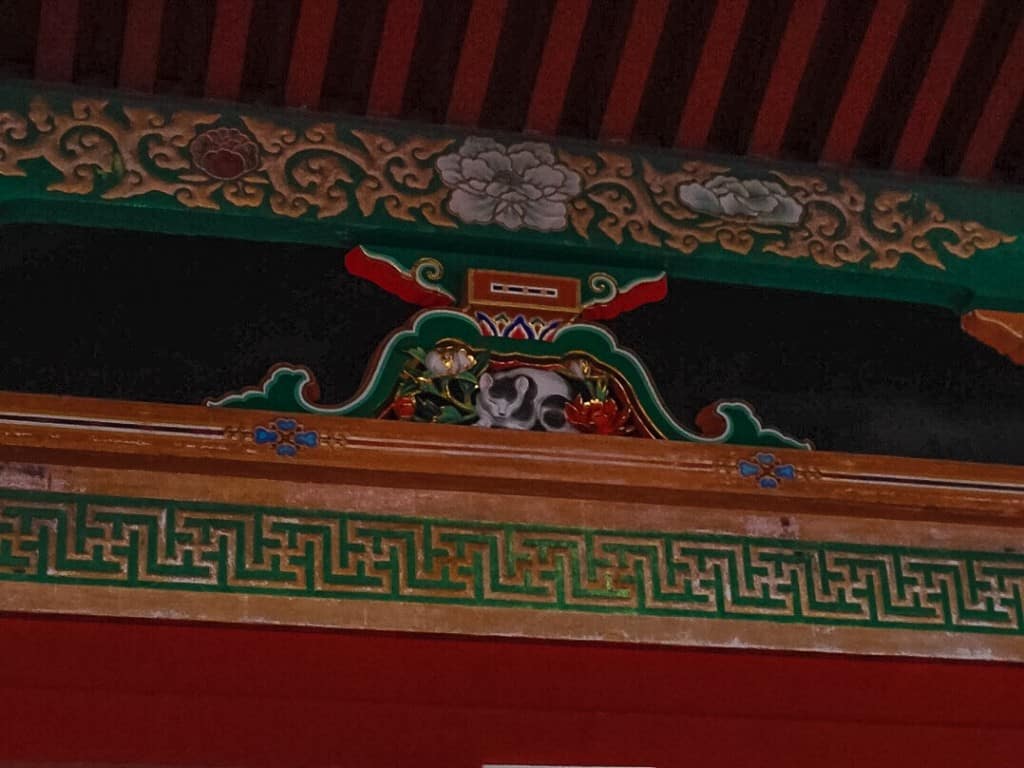 The very decadent and grand sleeping cat in Nikko Toshogu.