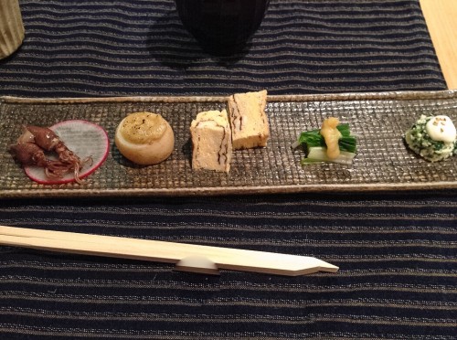 Kaiseki third course: squid, potato, egg, vegetables, and spinach.