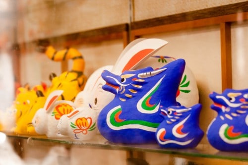 The Hariko dolls are created using a wooden frame, which is then coated in a Washi (Japanese paper) at the Takashiba Decoyashiki Workshop.