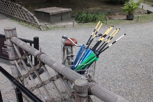 Umbrellas Being Transported Between the Entrances/Exit