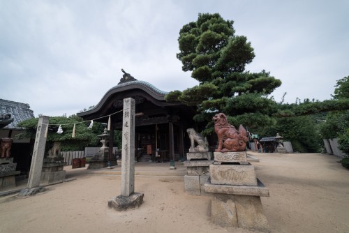 Kurashiki Shimotsui Gion Shrine and the Grand Seto Bridge in Okayama prefecture, Japan.