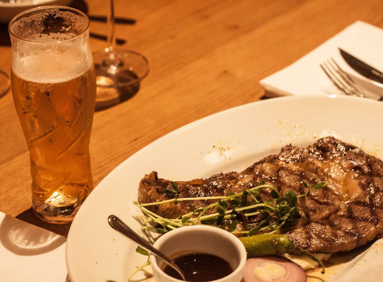 Grilled meal with beer