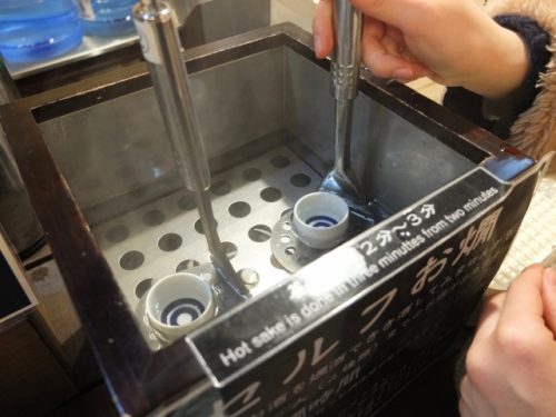Warming up sake at the Ponshukan Shopping Center, Echigo-Yuzawa Station.