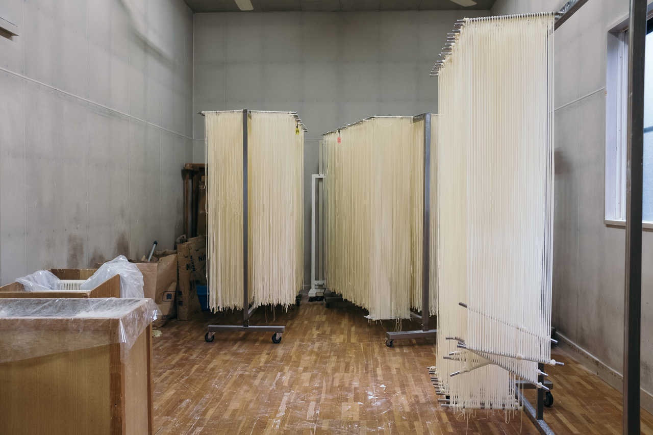 workshop of udon noodles handing off bars in japan