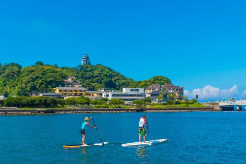 a couple rowing together on a peaceful water