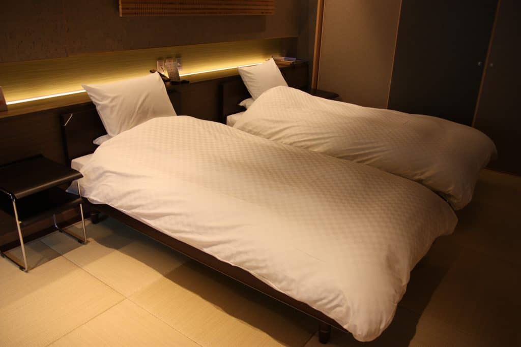 two modern beds in a traditional ryokan