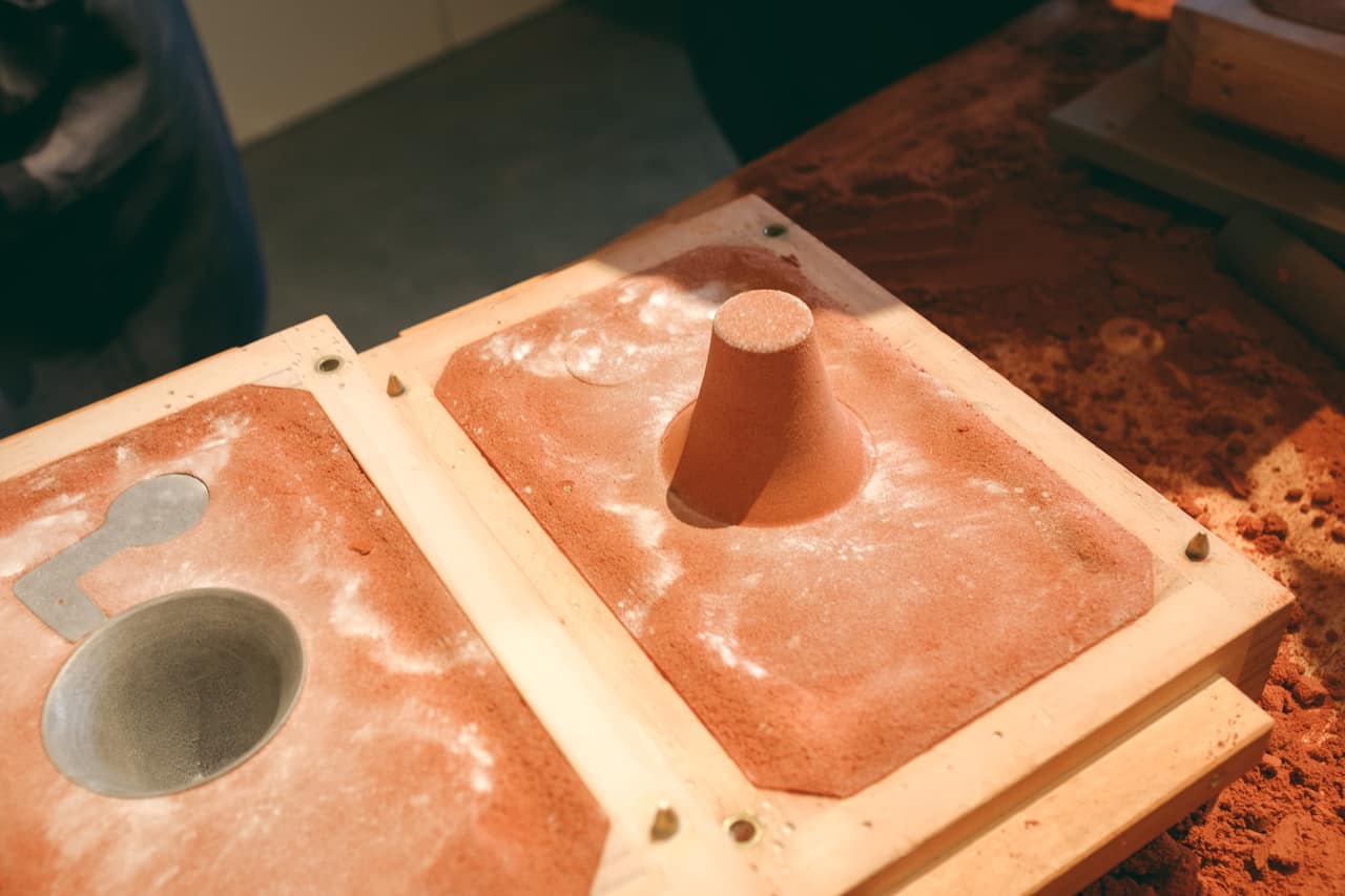 Making an iron cup at a metal workshop in Toyama Prefecture.