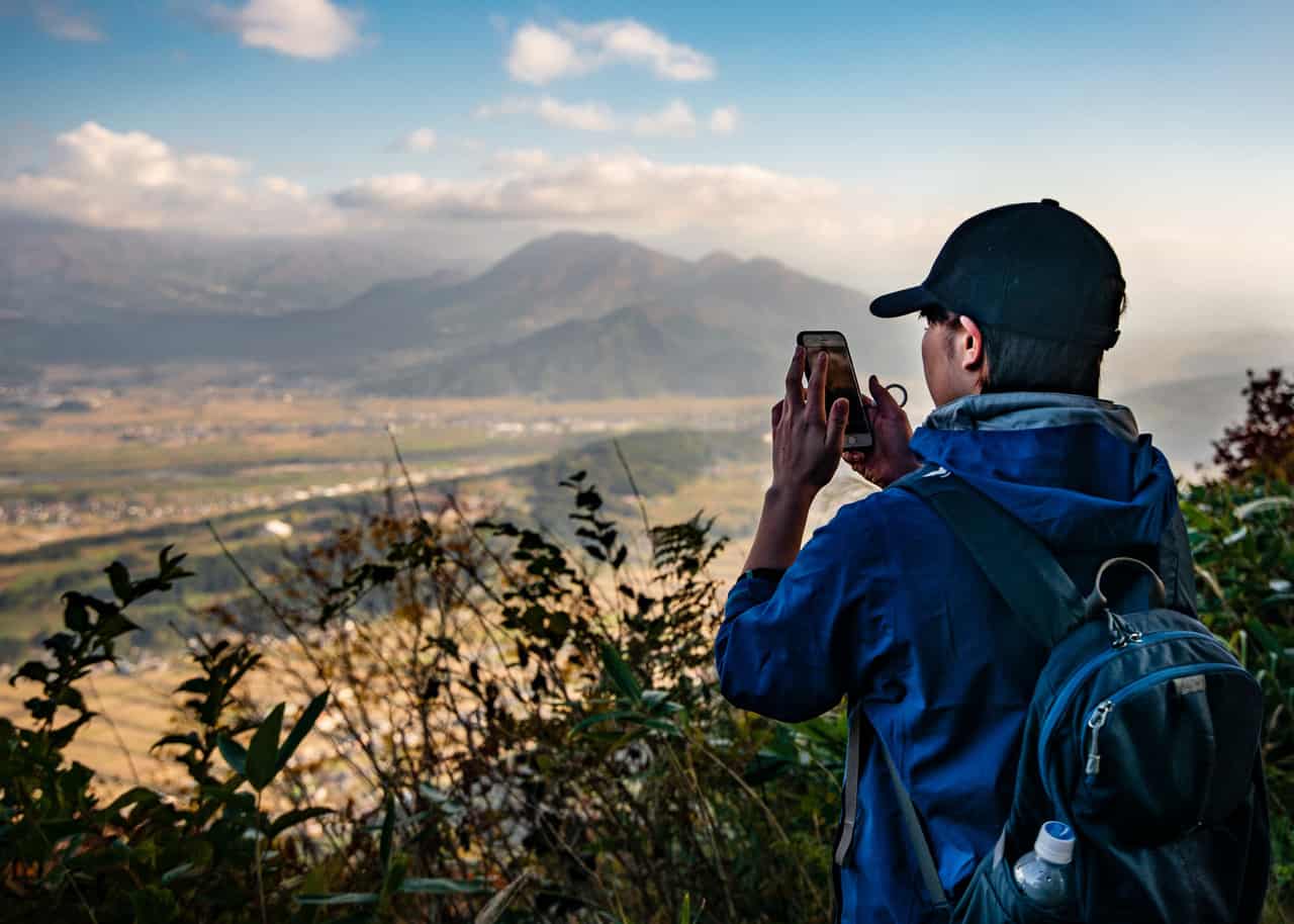 hiker enjoys the view of nagano from the shinetsu trail