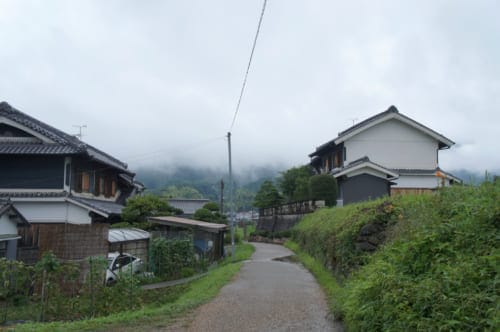 A small road bordered by traditional houses in Asuka 