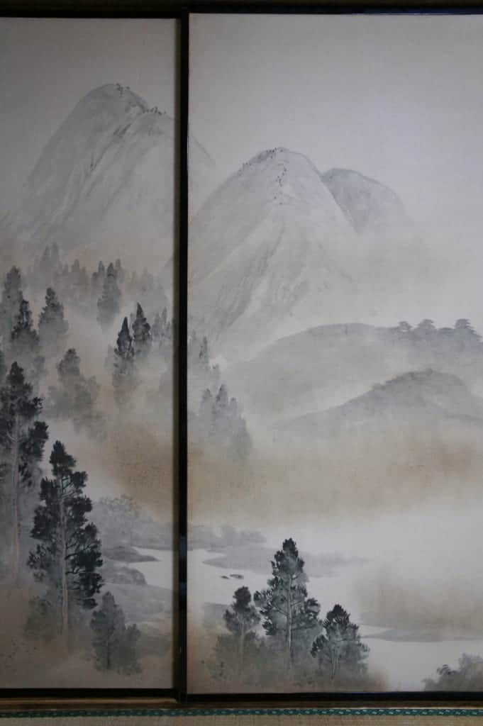 Traditional panel with a painting of mountain landscape