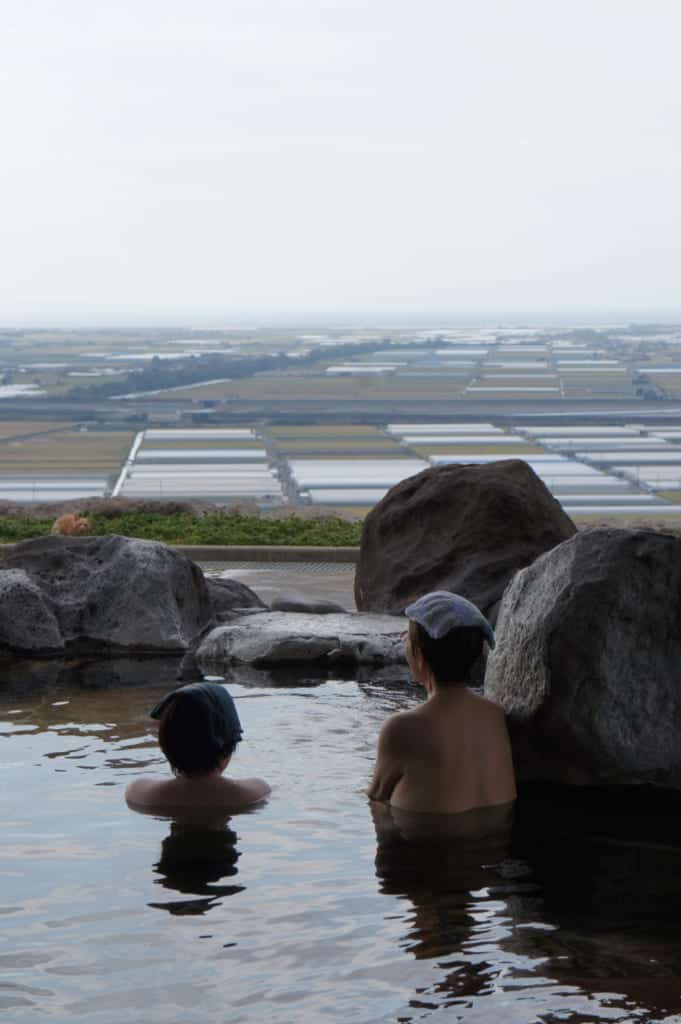 Two women, enjoying a bath at Kusamakura onsen Tensui