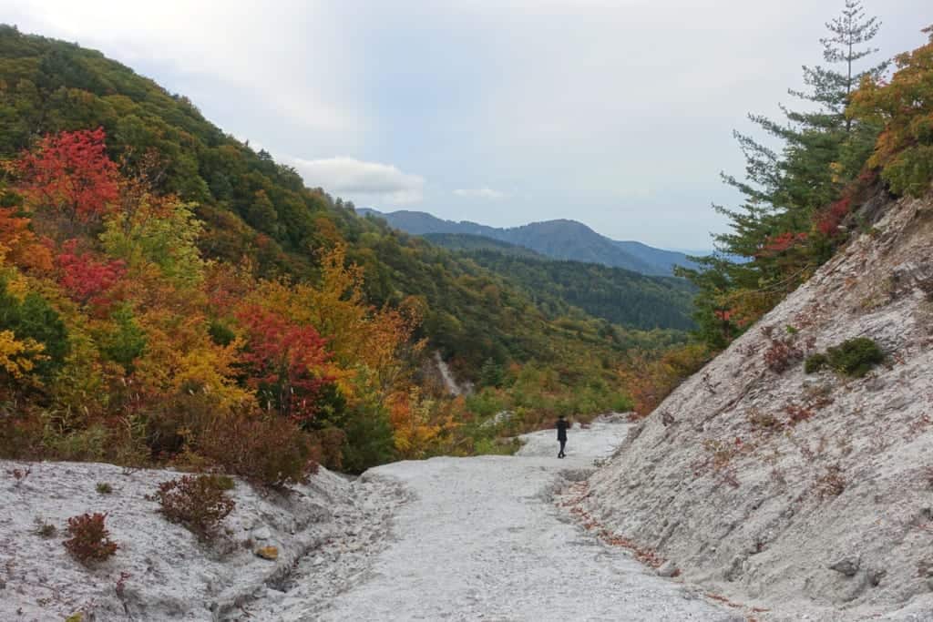 White stone path of jigoku kawarage in the middle of the autumn landscapes of Akita Prefecture