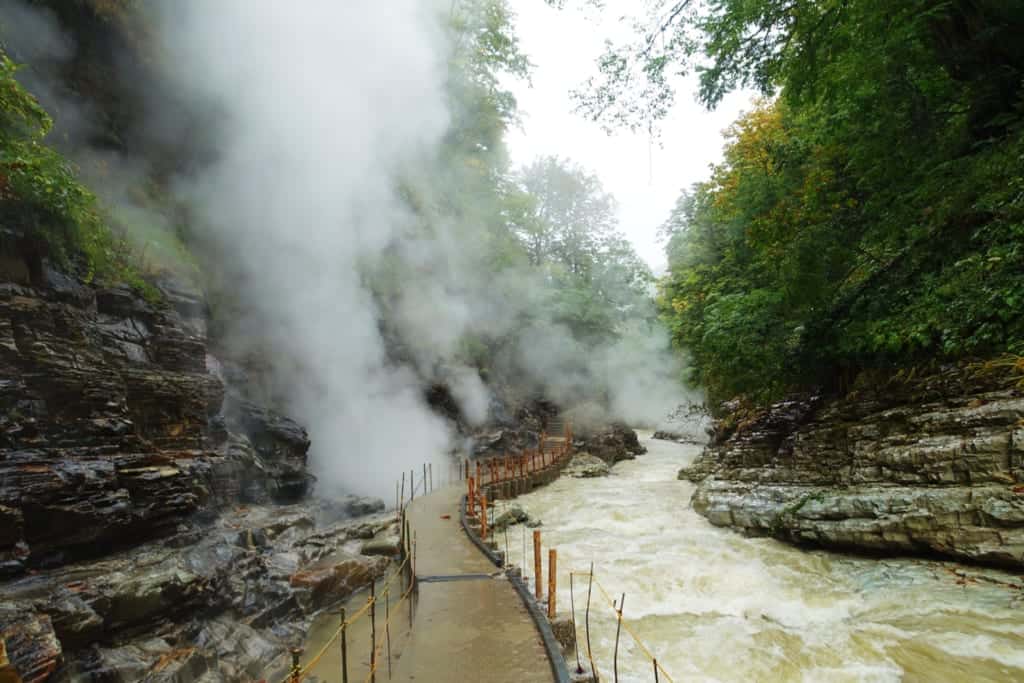 The hiking trail surrounded by dense clouds of steam