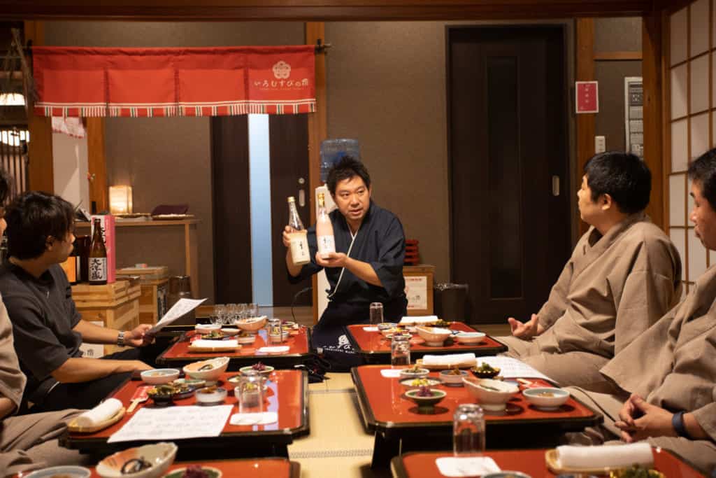 Mr. Takuya presenting sake in his inn. 