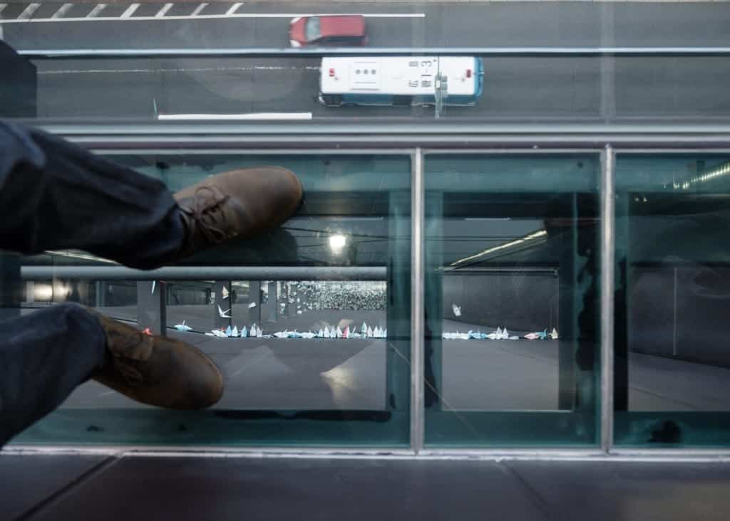 Standing on the glass floor at Orizuru Tower