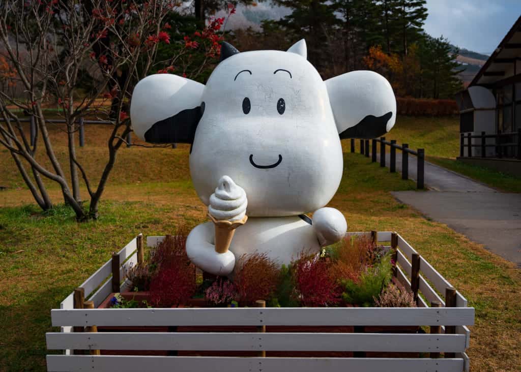 cow statue holding ice cream