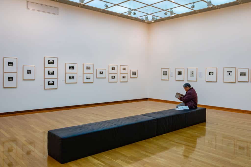 man sitting on bench at the Shoji Ueda Museum of Photography