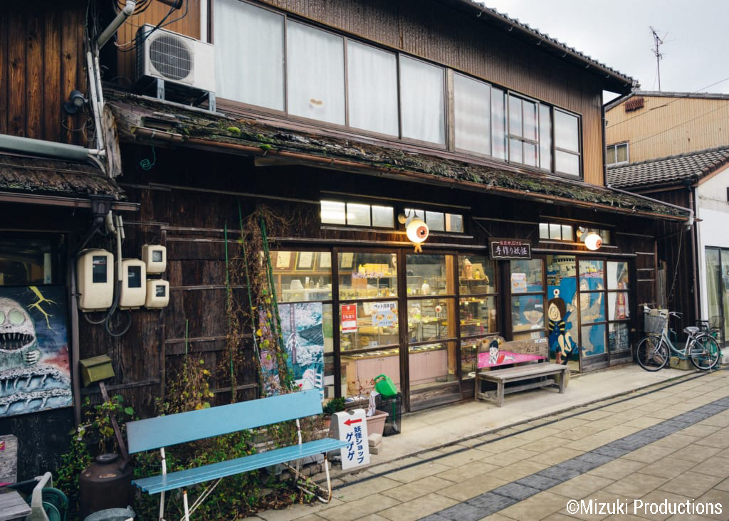 Shop on Mizuki Shigeru Road decorated with Kitaro images