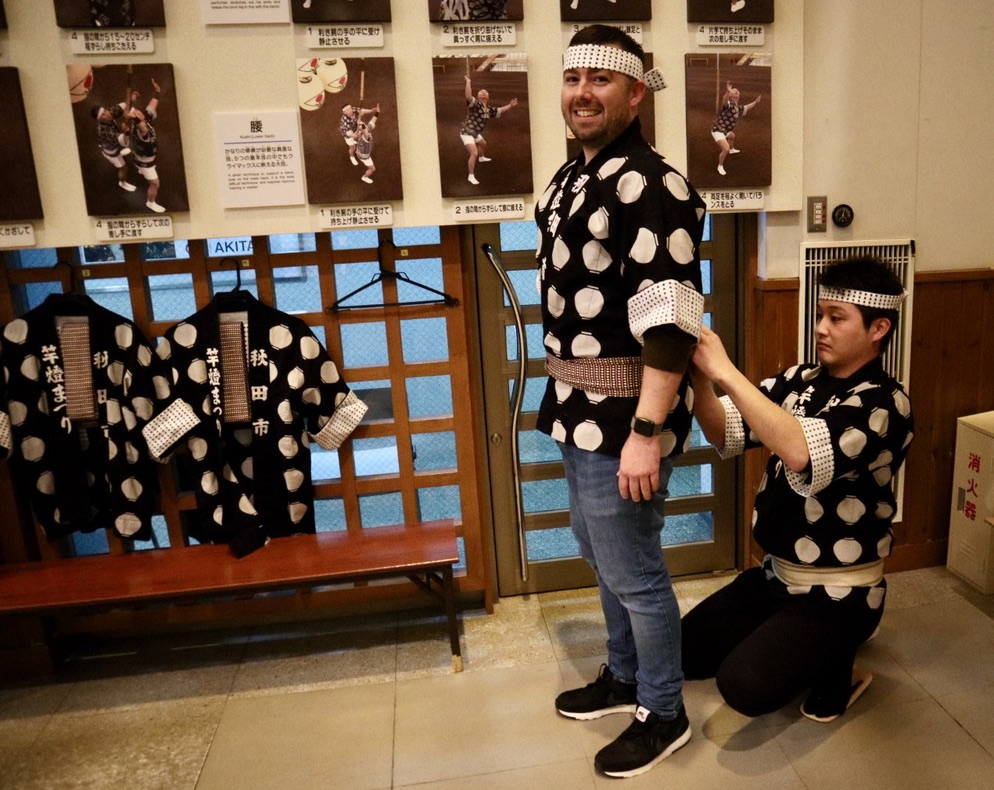 Mark getting dressed in traditional Akita kanto robes
