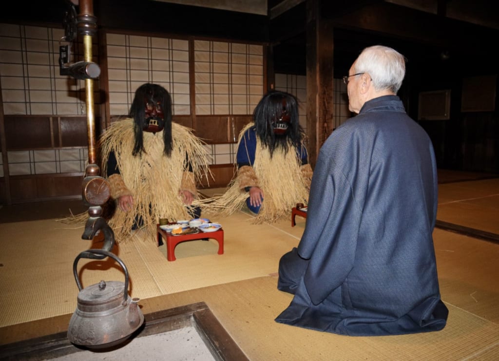 The reenactment of the Namahage scene from inside the Japanese house