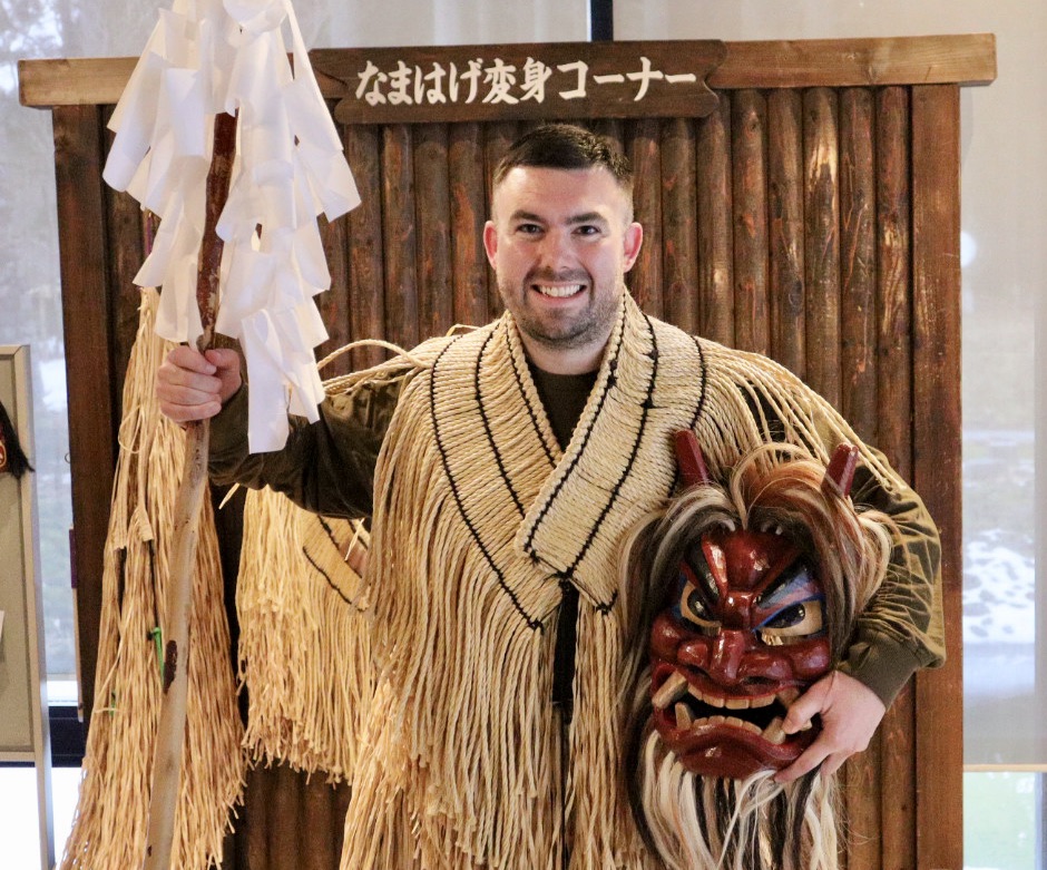 Wearing the costume of the Namahage