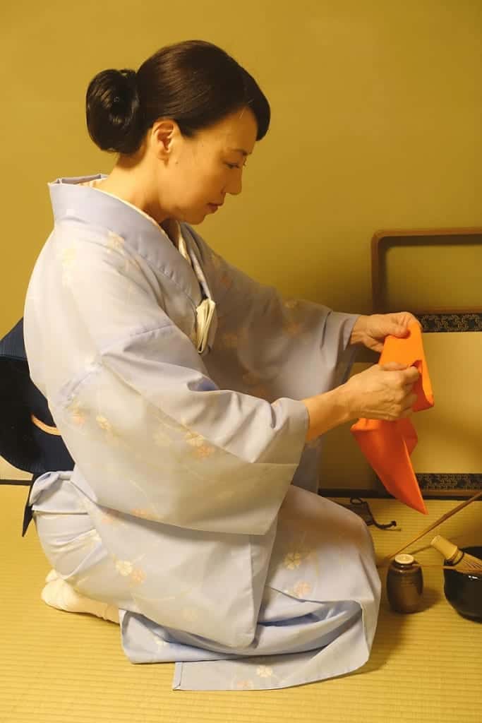 Mika repeats a succession of folds and unfolds of the fukusa during a Japanese tea ceremony workshop