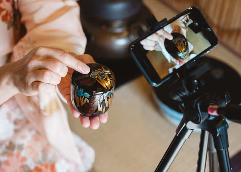 showing utensils during online tea ceremony