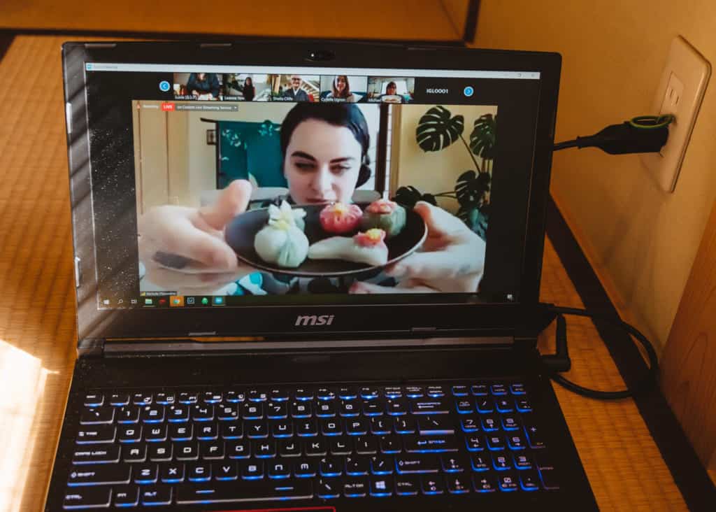 participant showing wagashi sweeting during online tea ceremony