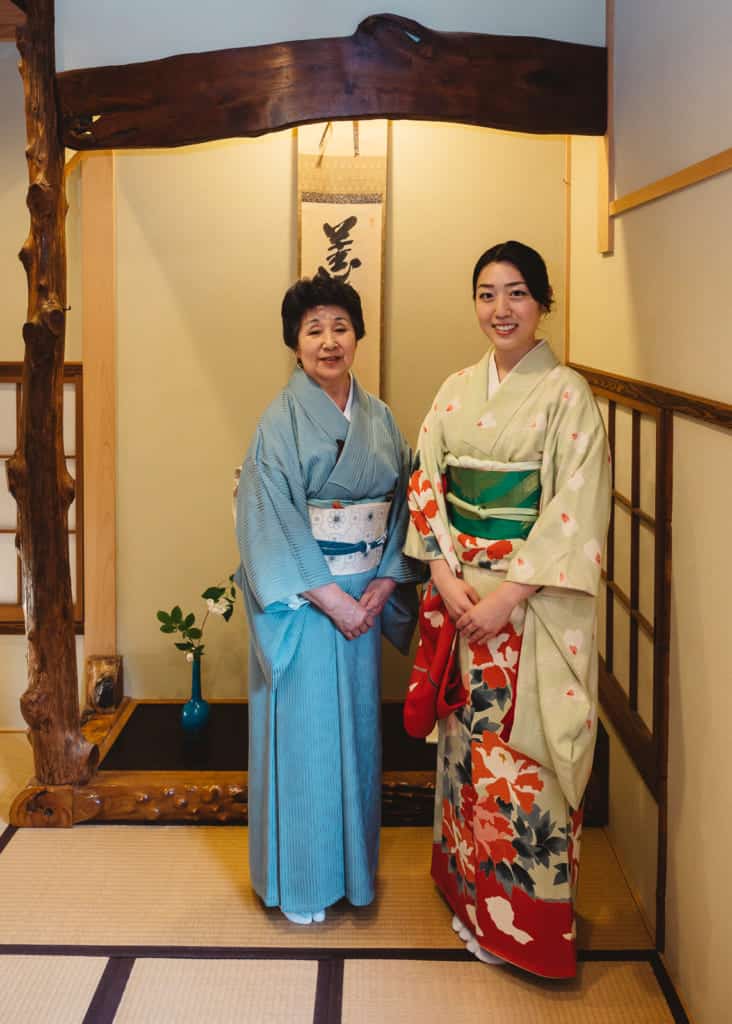 two women in kimono in tea room