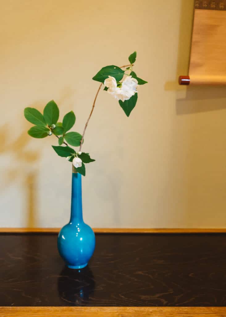 blue vase with flowers for tea ceremony