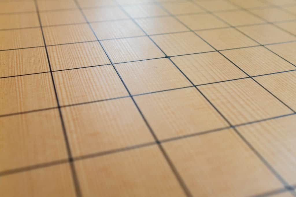 the lines of a goban are drawn with lacquer using a japanese sword