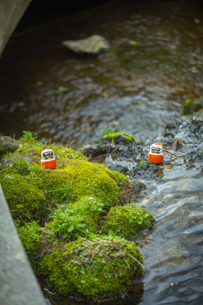 two daruma in a stone