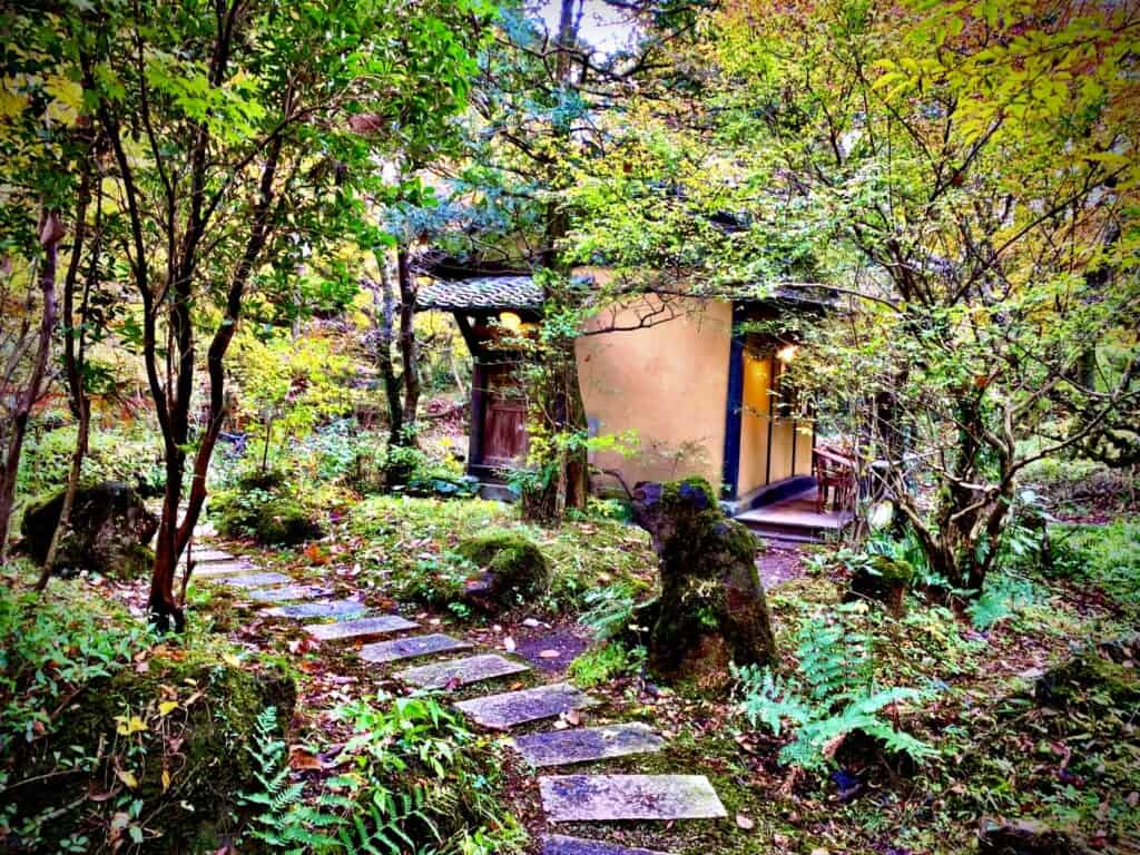 Sennomori grounds walkway through Kumamoto forest at traditional japanese ryokan inn