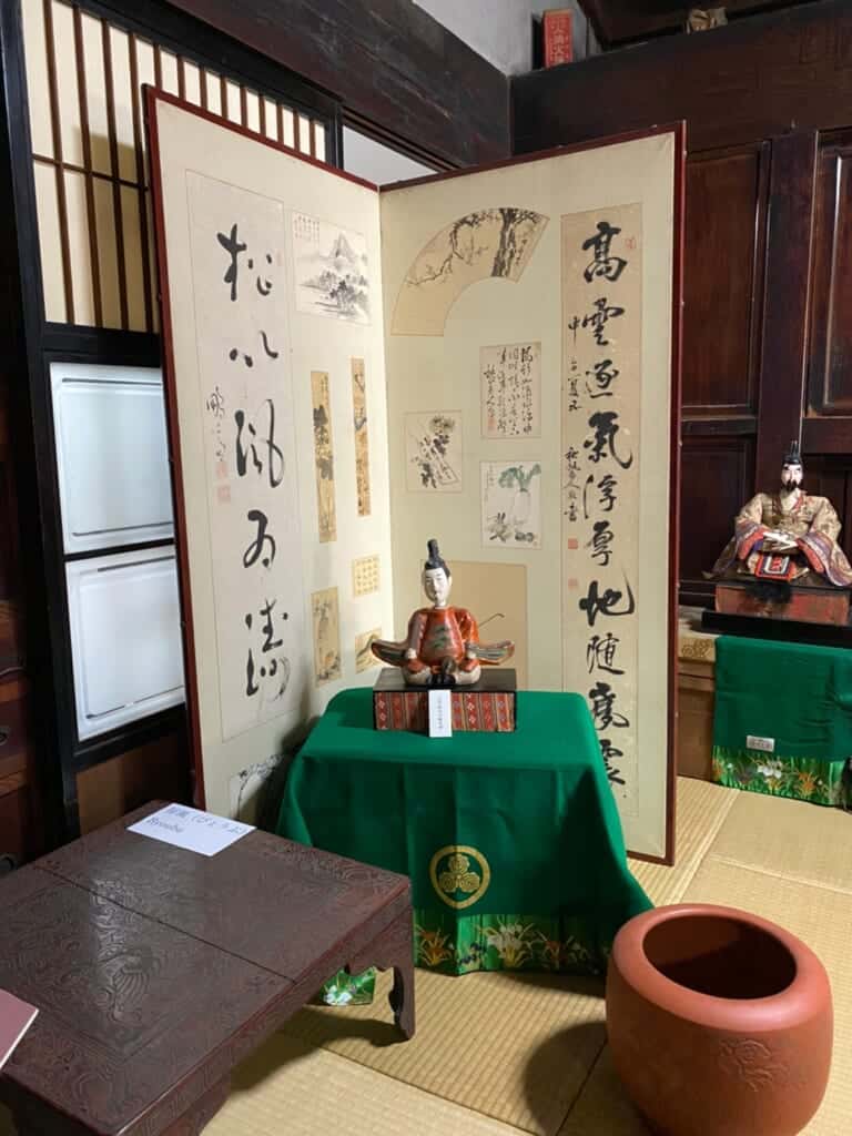 One of the rare Tenjin dolls made out of Paulownia wood and lacquer powder, made by Minoru Aono, in a Traditional Japanese house on the Tokaido Road
