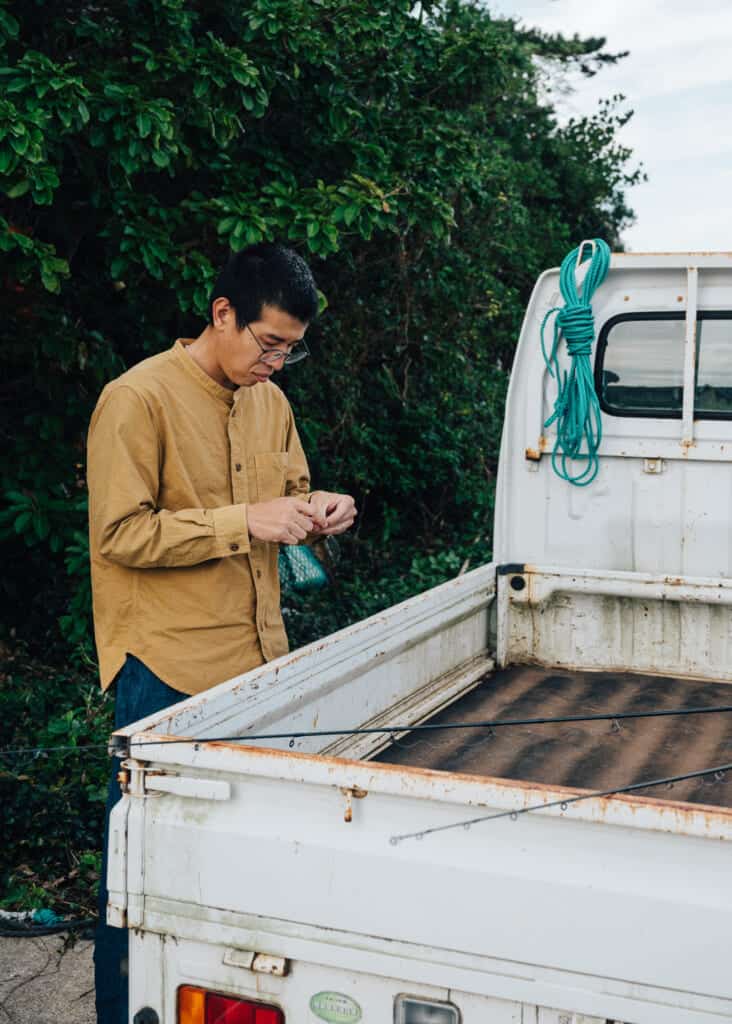 Hashi from Yanoya guesthouse on Ojika Island prepares fishing line