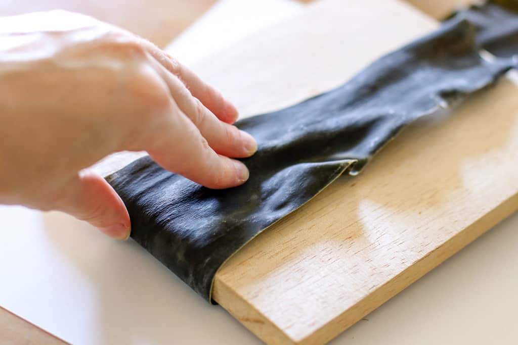 Cutting kombu kelp at Kamui Kaigan Park on Rishiri Island, Hokkaido