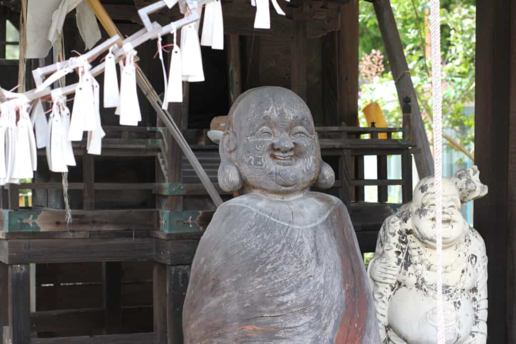 Wooden Buddhist statues in Japanese countryside