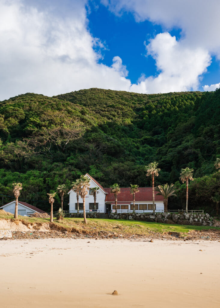 palm trees and restaurants at takahama beach goto islands