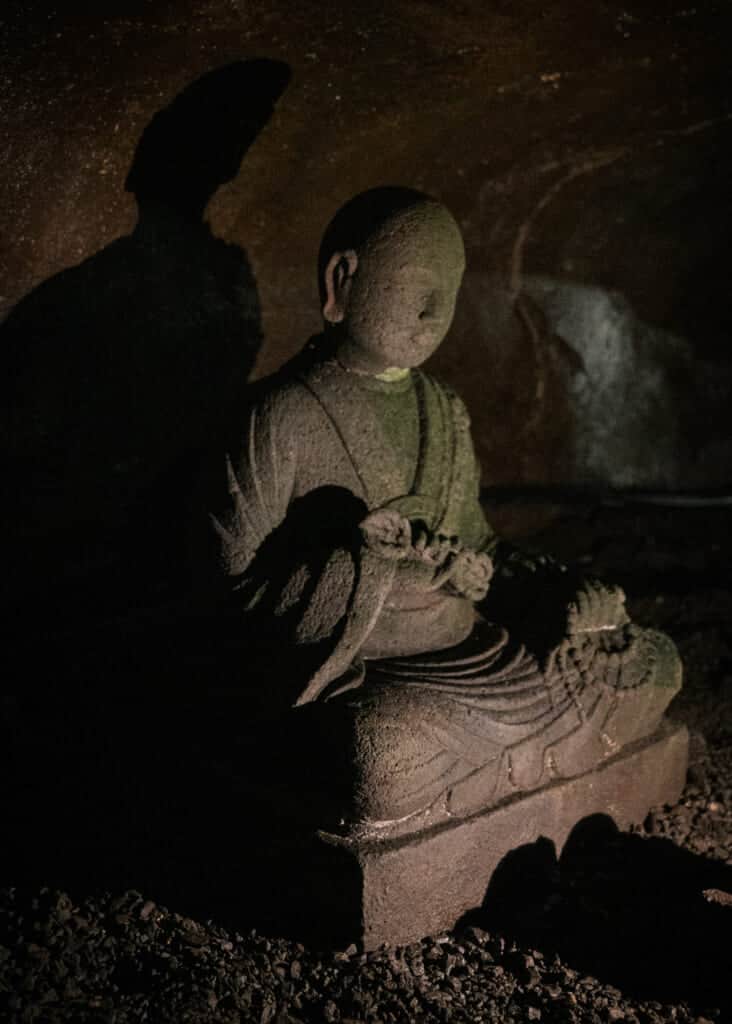Stone Statues in Interior of Iwaya Cave on Enoshima Island