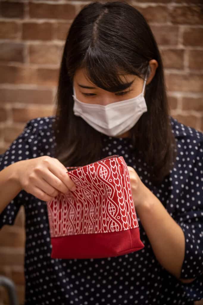 Minako checking their textile articles 
