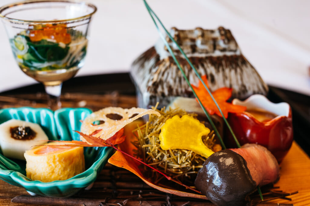 closeup of Traditional Japanese cuisine with autumn theme in restaurant near Kyoto