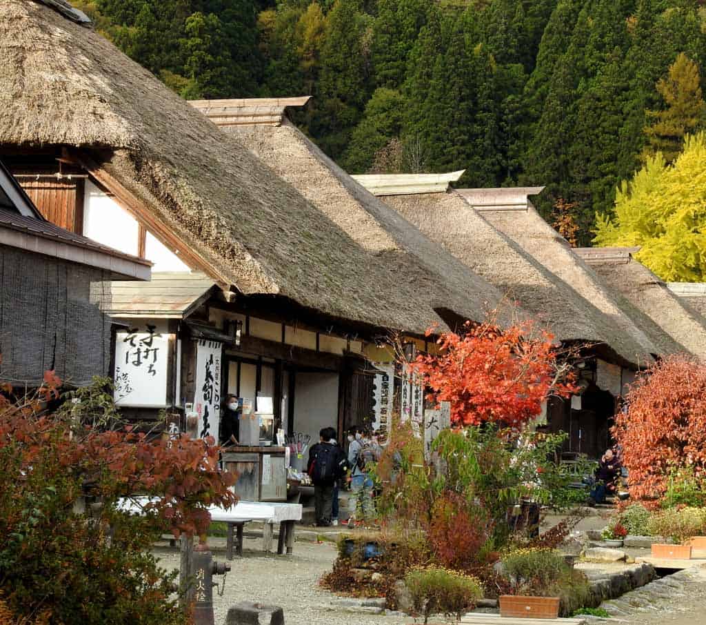 thatched roof traditional houses along the Ouchi-juku post town in japan