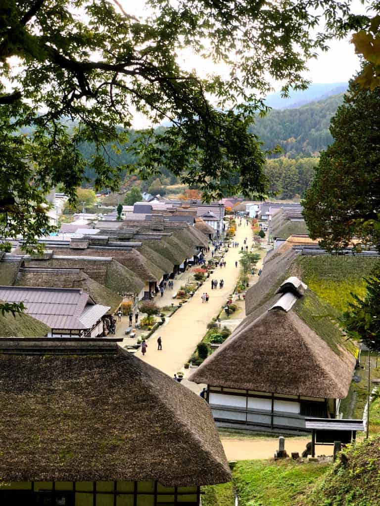 view of thatched roof traditional houses along the Ouchi-juku post town in japan