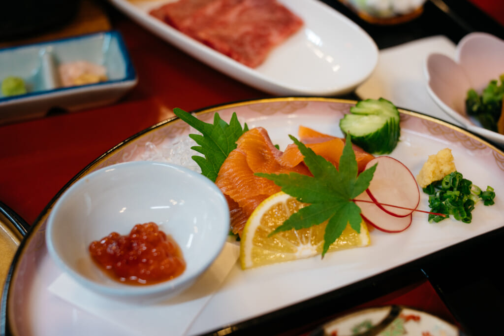 raw fish dish in traditional japanese ryokan in usuki, kyushu