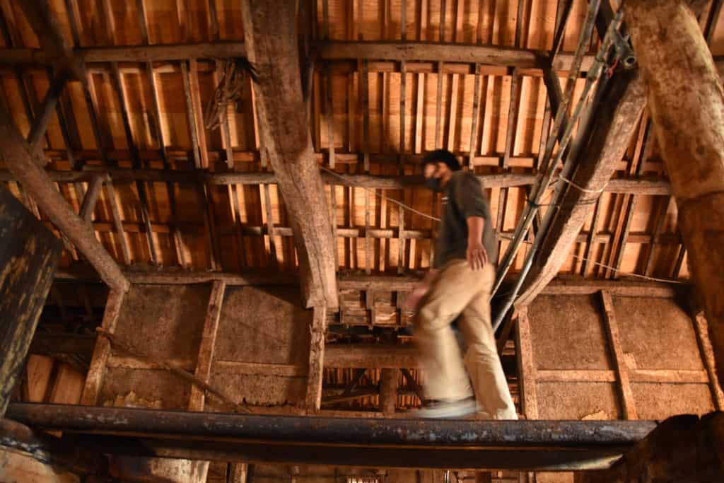 man walking through soy sauce factory in japan