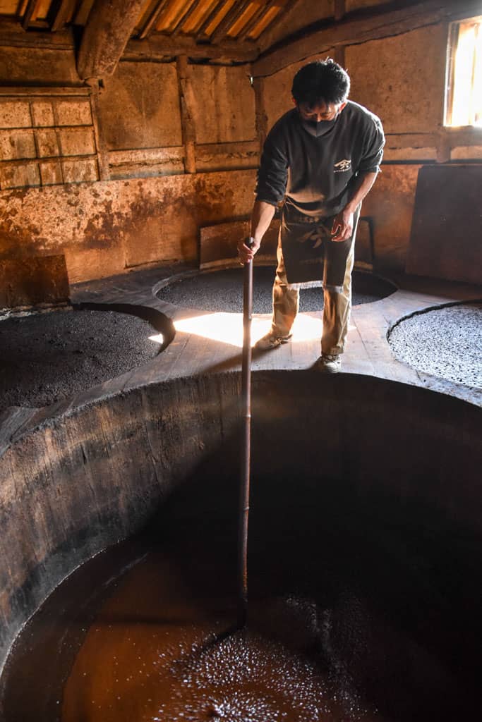 man stirring soy sauce in japan  on Shodoshima, Shikoku island 