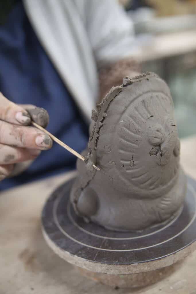 fixing the tanuki edges after removing the mold