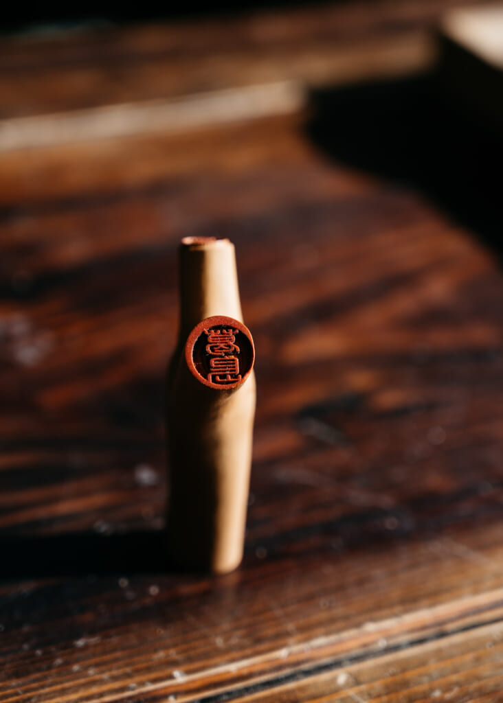 A Japanese hanko carved from a leftover branch of a camellia tree on goto islands